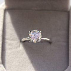 Moissanite Sterling Silver Ring Presented in a beautiful grey velvet gift box. Look at that rainbow sparkle!