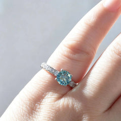 Moissanite pavé solitaire ring on the finger