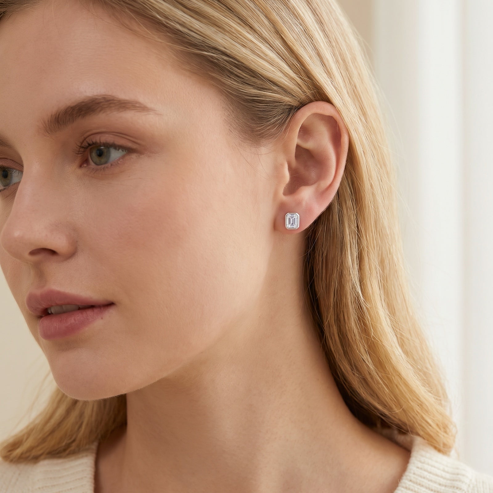 Emerald Cut Moissanite Stud Earrings worn on the ear
